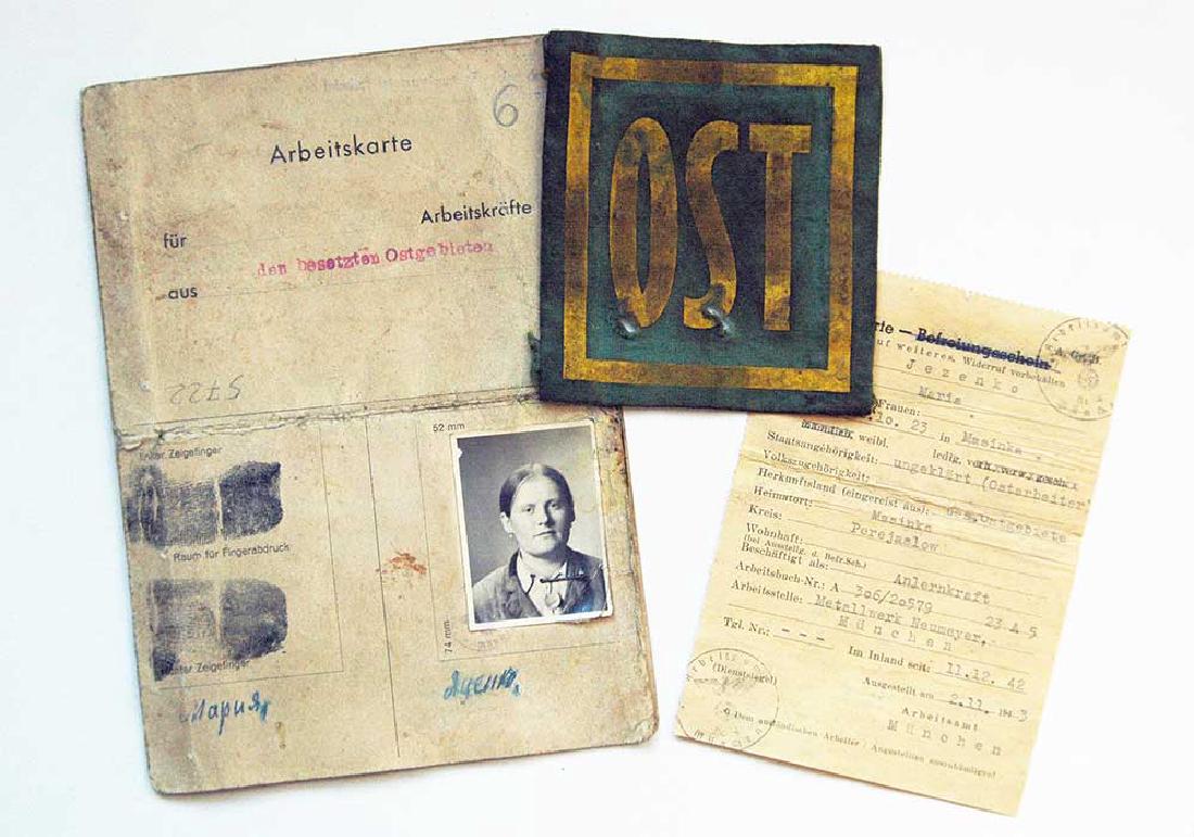 German WW2 Arbeitskarte for Ukrainian + patch OST: The German regimes in the occupied countries of Europe force Jews and OST workers to wear an identifying mark under the threat of death. German signs was required to be worn by all OST worker in Germa