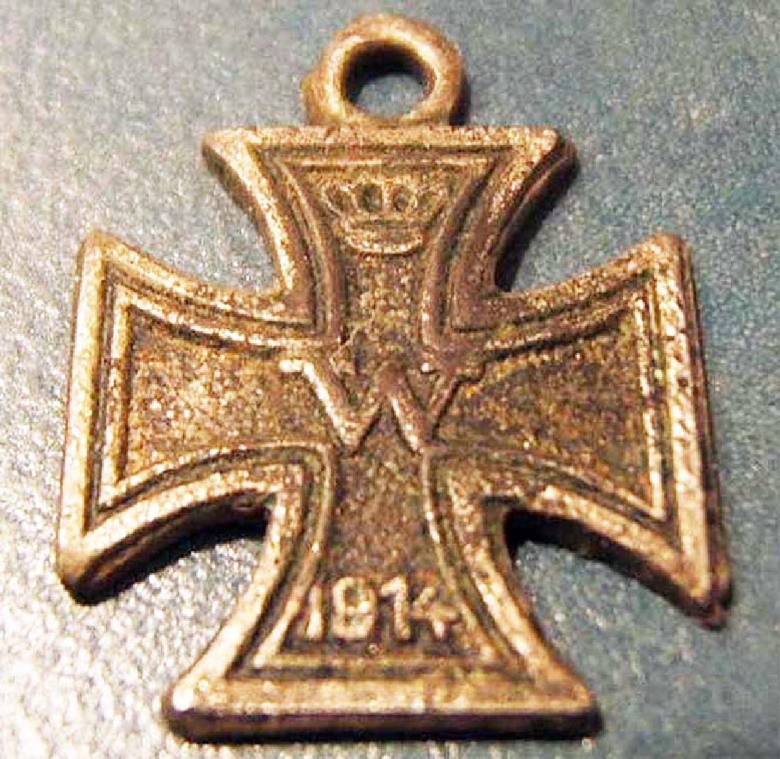 German WW1 Iron Cross, Miniature 1914: This quality flat issue pattern Cross shows light age patina to the silver frame and minor wear to the well detailed border and to the highlights of the Prussian crown, 'W ' and date '1914 ' on the bl