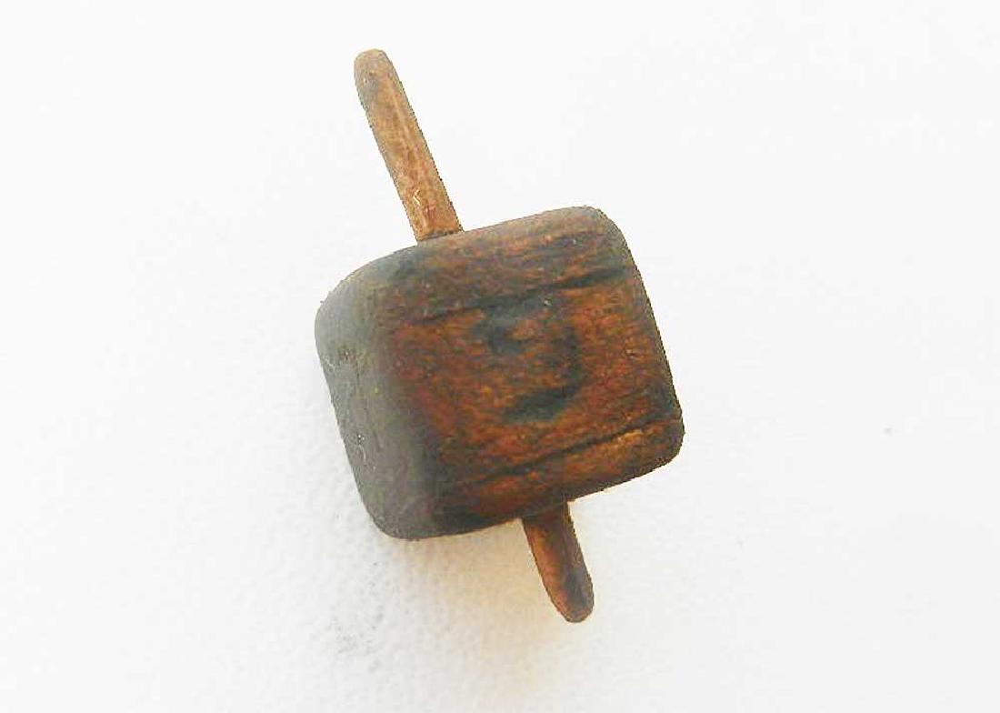 Jewish WW2 Children GAME dreidel fr. Litzmannstadt: Rare Jewish WW2 Wood Children GAME dreidel from Litzmannstadt in Poland. It was very popular in any Jewish family at that time. Size: 28 x 13 mm. This item was obtained from a large old collection in 