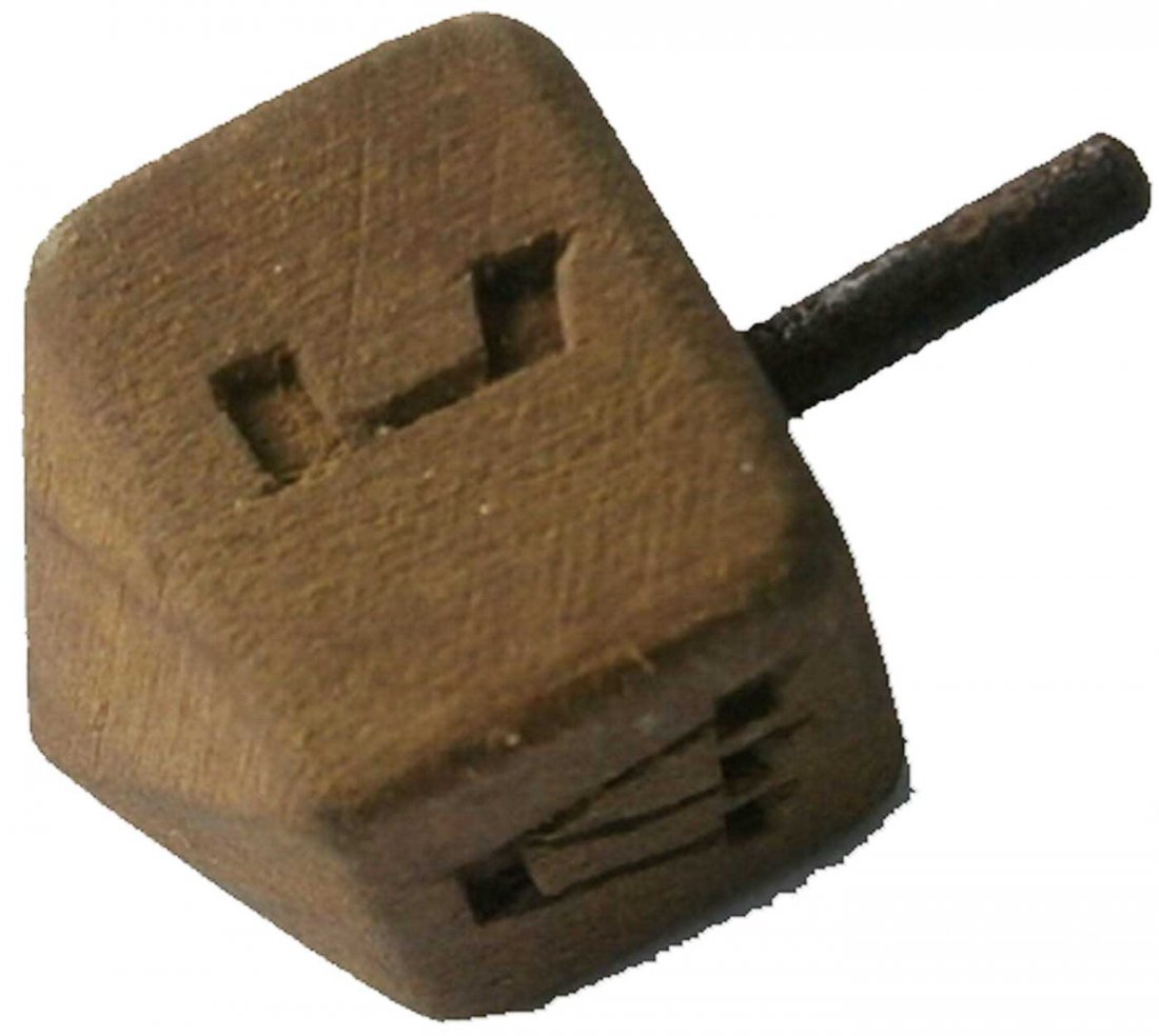 Jewish WW2 Children GAME Dreidel fr. Litzmannstadt: Rare Jewish WW2 Wood Children GAME Dreidel from Litzmannstadt in Poland. It was very popular in any Jewish family at that time. Made in wood. Size: 24 x 13 mm. This item was obtained from a large old 