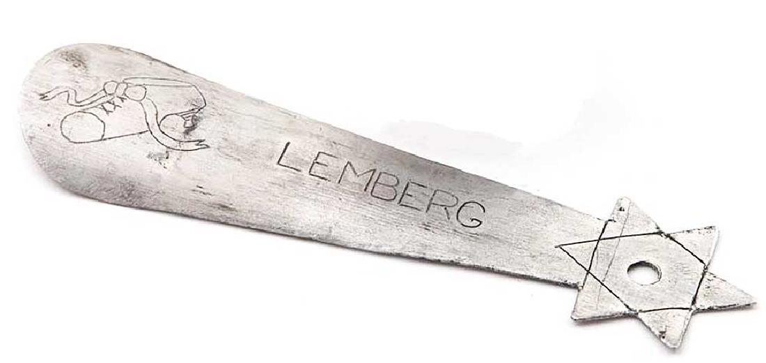 Jewish WW2 SHOEHORN w. Star of David, GHETTO 1940s: Original WW2 SHOEHORN with Star of David from Jewish GHETTO in LEMBERG (Poland - Ukraine), 1940s. The aluminum shoehorn is from the Lemberg Lvov (Lviv) Ghetto. It is engraved Lemberg and image of shoe