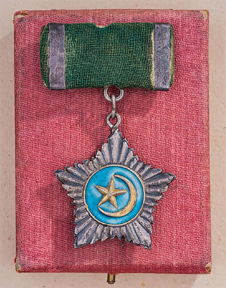 Soviet Republic Order Turkestan, Boxed, 1944-1949: Extremely Rare Early Soviet Republic Order of East Turkestan Republic, 1944 - 1949. It is silver order, 2nd class. Its named 'Struggle for independence'. The order has a number 134 and year 1945. Its 