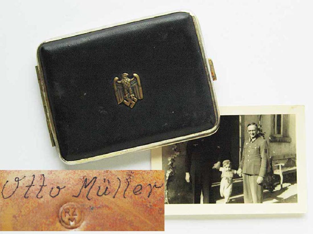 German WW2 Cigarette Case + Owners Photo, 1942 Krim: German WW2 Cigarette Case with Eagle and Swastika, Gold in Color. The case has an Inscription in German: 'OST FRONT. KRIM 1942. OTTO MULLER'. Now you can find more information about this person. As yo