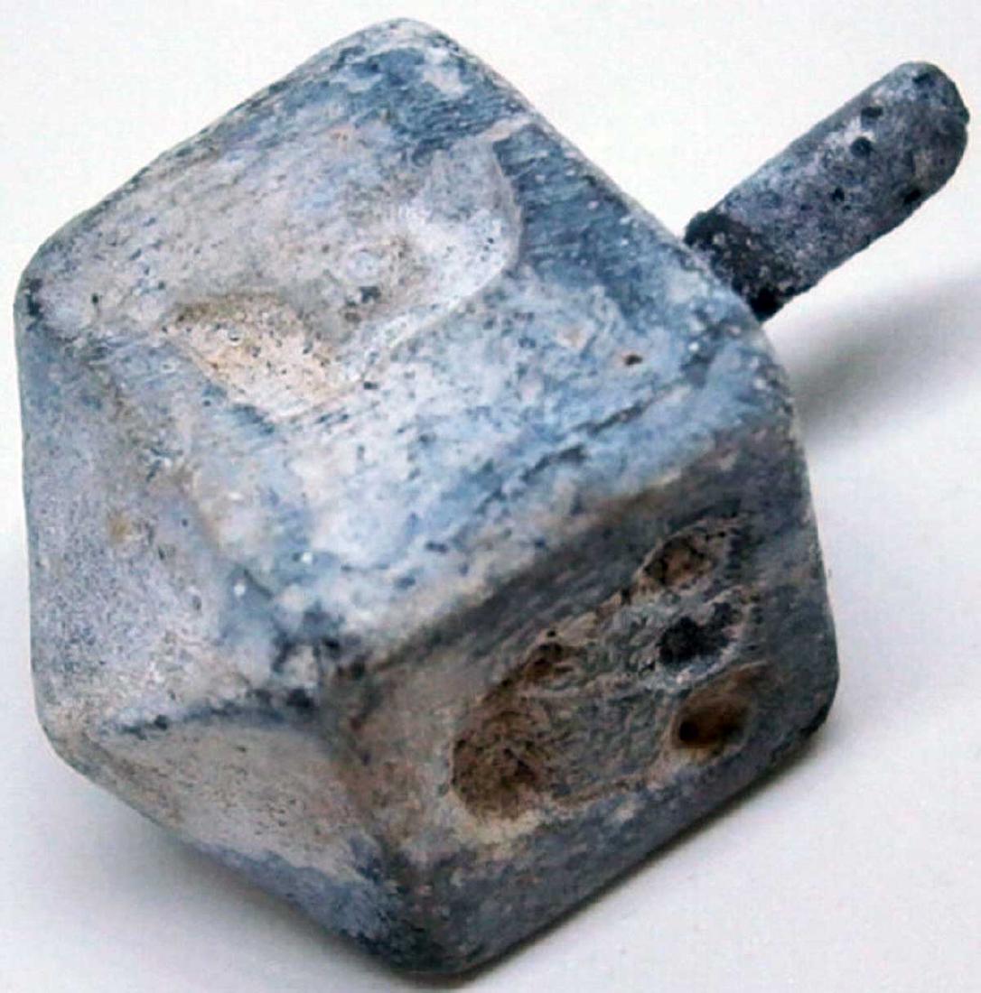 JEWISH WW2 CHILDREN GAME DREIDEL fr. LITZMANNSTADT: JEWISH WW2 CHILDREN GAME DREIDEL from LITZMANNSTADT in POLAND It was very popular in any Jewish family at that time. Made in metal. SIZE: 28 x 15 mm. This item was obtained from a large old collection
