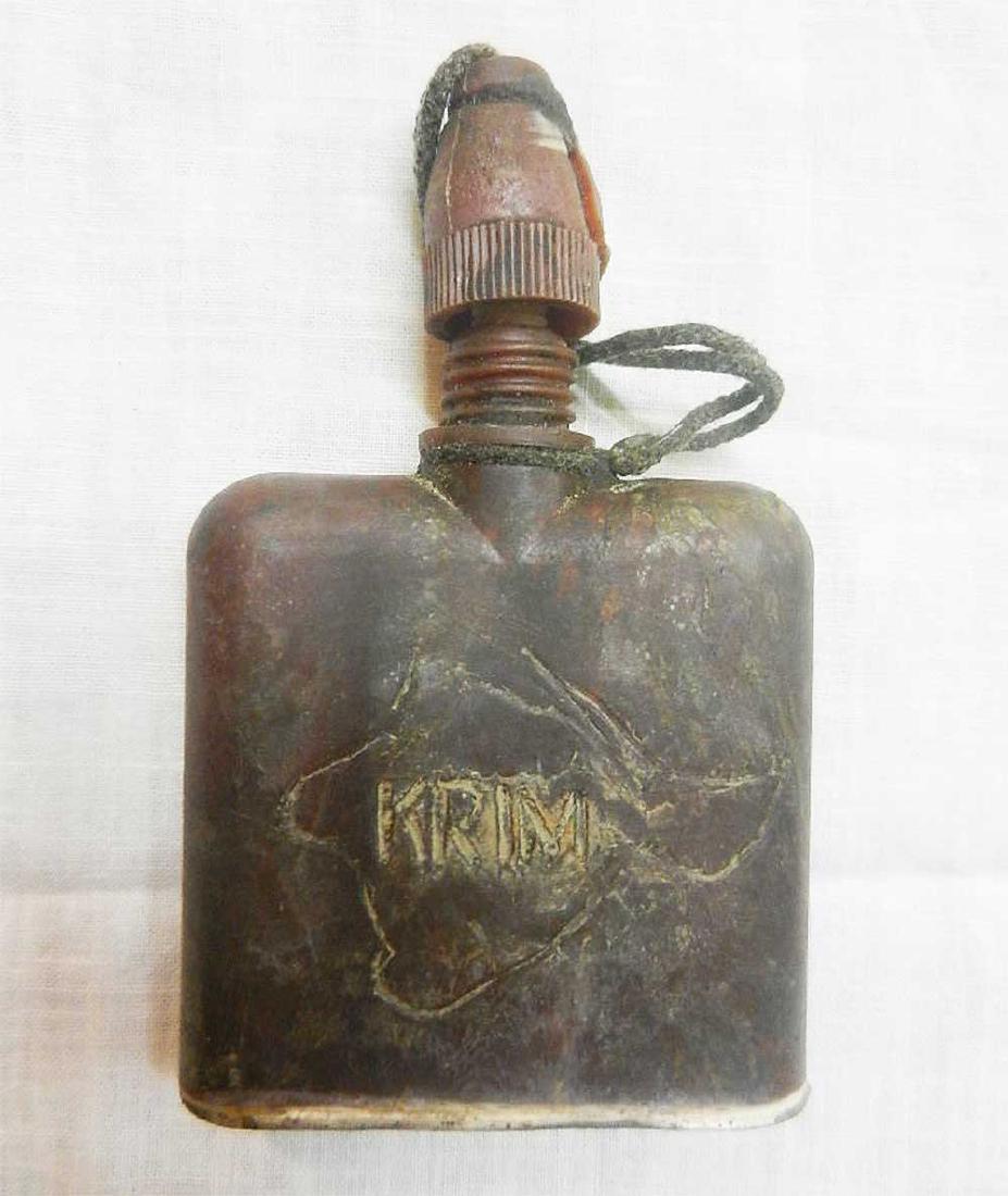 GERMAN WW2 BOTTLE, KRIM HAUTENTGIFTUNGSMITTEL: GERMAN WW2 BOTTLE, KRIM HAUTENTGIFTUNGSMITTEL Engraved, 1941-1943 Hautentgiftungsmittel. SIZE: 95 x 62 x 19 mm (3.7 x 2.4 x 0.7 inches). This item was obtained from a large old collection in Europe. P