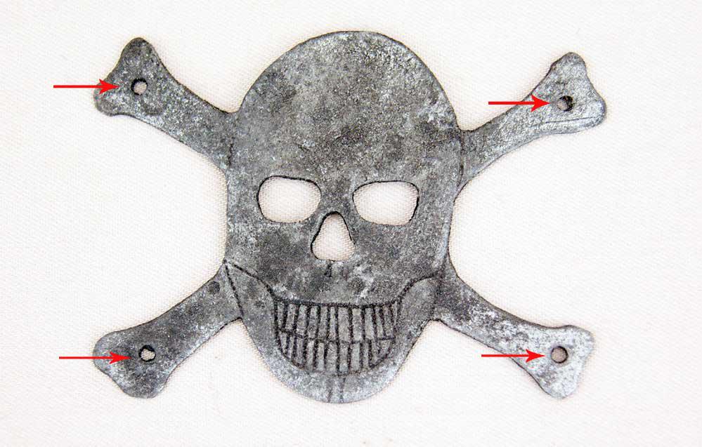 GERMAN WW2 SKULL & BONES, 1941-1945 TRENCH ART: GERMAN WW2 SKULL and BONES for HELMET Trench art, 1941-1945. Aluminum. SIZE: 65 x 50 mm (2,55 x 1,96 inches). Nice item was found on battlefield in Kurland in German positions. Very collectible item.