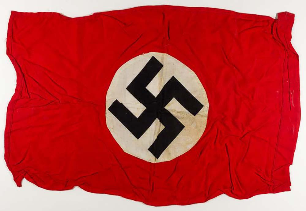 GERMAN WW2 DOUBLE-SIDED NAZI NSDAP BANNER, SWASTIKA: GERMAN WW2 DOUBLE-SIDED NAZI NSDAP BANNER, SWASTIKA Double sided NSDAP banner, a red field with applied White disks on each side, each printed with a mobile swastika. The hoist edge has been folded ov
