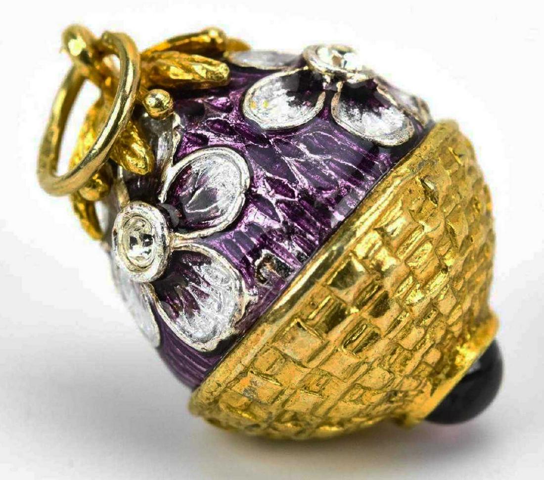 RUSSIAN SILVER & ENAMEL EGG, NECKLACE PENDANT CHARM: RUSSIAN SILVER and ENAMEL EGG, NECKLACE PENDANT CHARM Vermeil silver with floral motif. Marked on the ring. SIZE: measures just over 1 inch in length. ESTIMATE PRICE: $900 - $1000. Recently Russian Si