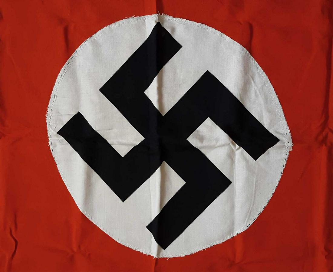 GERMAN WW2 NAZI NSDAP FLAG w. SWASTIKA: GERMAN WW2 NAZI NSDAP FLAG with SWASTIKA Red field with applied white disks printed with a mobile swastika. The hoist edge has been folded over and sewn, allowing the flag to be flown. Please note: la