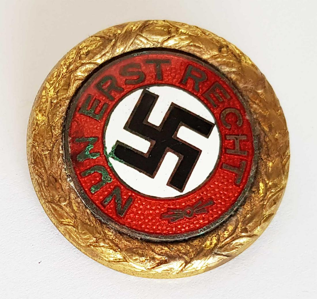 EXTREMELY RARE GERMAN NSDAP PARTY BADGE 1st VARIANT: EXTREMELY RARE GERMAN pre WW2 NAZI NSDAP GOLD PARTY BADGE, 1st VARIANT This example is a golden "NUN ERST RECHT" (NOW FIRST RIGHT) members pin measuring roughly 30 1/2 mm in diameter, die struck, allo