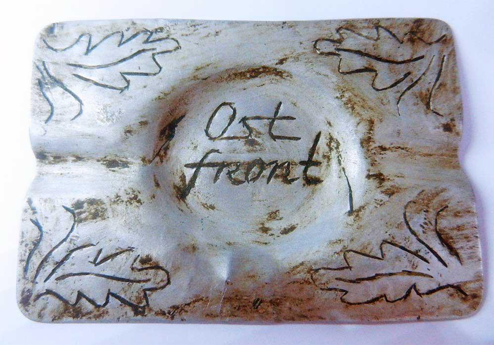 GERMAN WW2 ASHTRAY EASTERN FRONT, 1941-1945: GERMAN WW2 ASHTRAY EASTERN FRONT, 1941-1945 The ashtray has inscription: OSTFRONT. Trench art. Very unusual design. Original, not reproduction. The item is perfect for museum or private collection. CO
