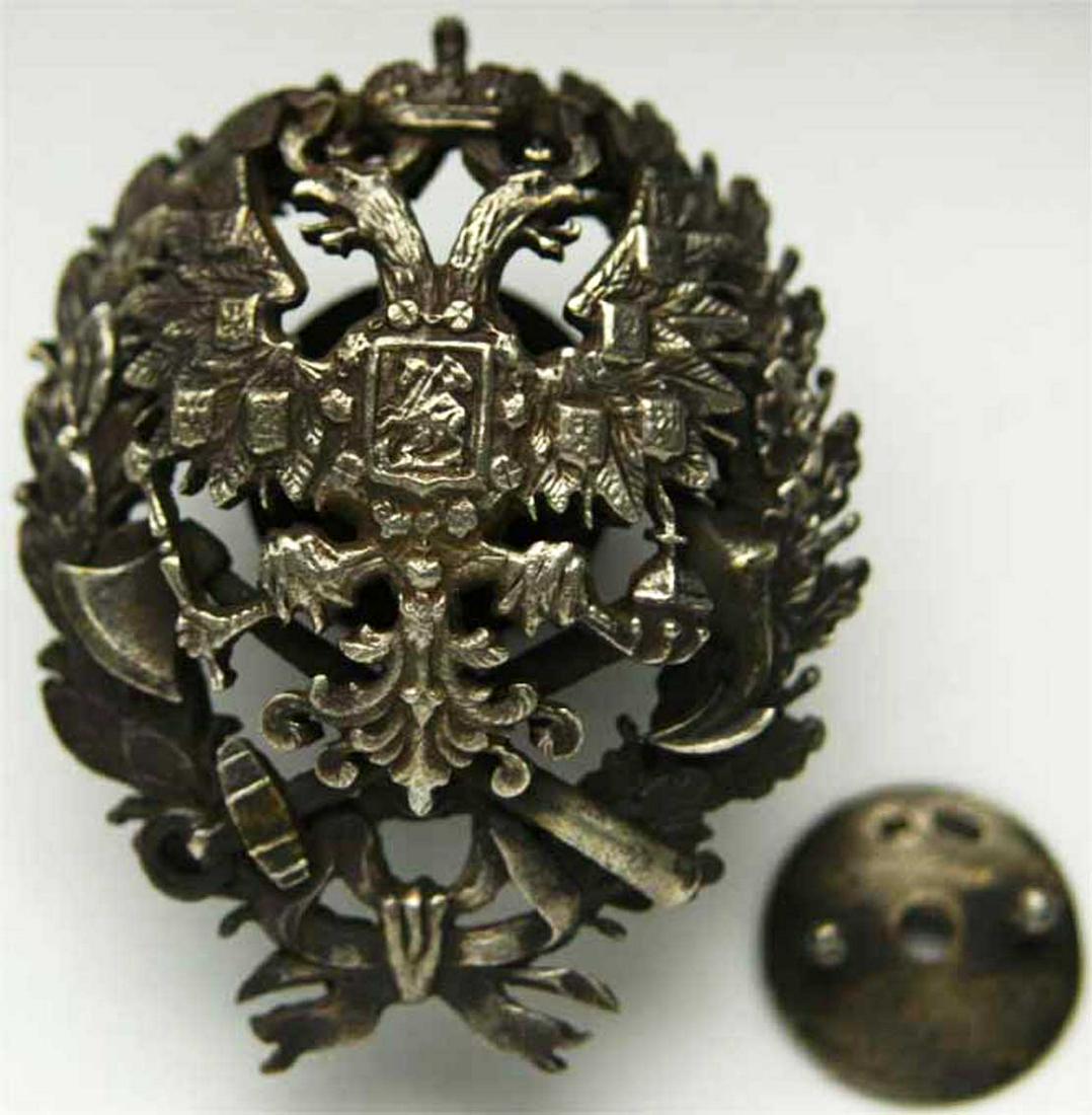 RUSSIAN IMPERIAL BADGE, RAILWAY ENGINEERS, 1866: RUSSIAN IMPERIAL BADGE, RAILWAY ENGINEERS, 1866 Silver Badge, marking the graduation for the Institute of the Railway Engineers, 1866. Silver academic badge supplemented with a crossed silver axe and 