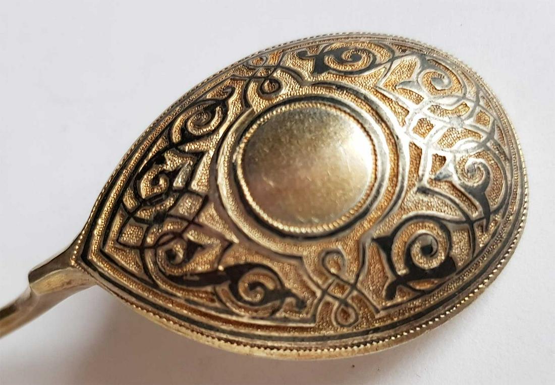 RUSSIAN NIELLO STERLING SILVER SPOON, MARKED: RUSSIAN NIELLO STERLING SILVER SPOON, MARKED, 1873 It has a few stamps - please see the image. Workmaster - CAC in Russian. CONDITION: The item is described to the best of our knowledge. Please refer 