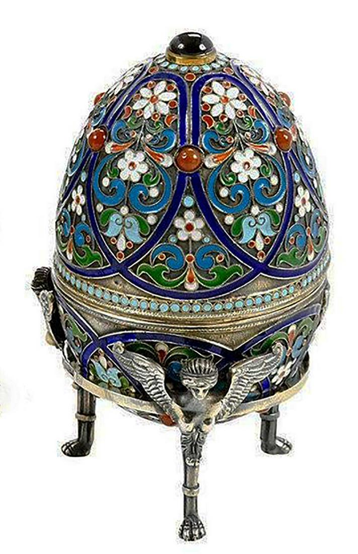 RUSSIAN IMPERIAL SILVER & CLOISONNE EGG, FOOTED: RUSSIAN IMPERIAL SILVER and CLOISONNE EGG, FOOTED A magnificent, fine and impressive, composite of antique Russian silver gilt polychrome cloisonnee enamel egg. The surface of each piece is embellishe