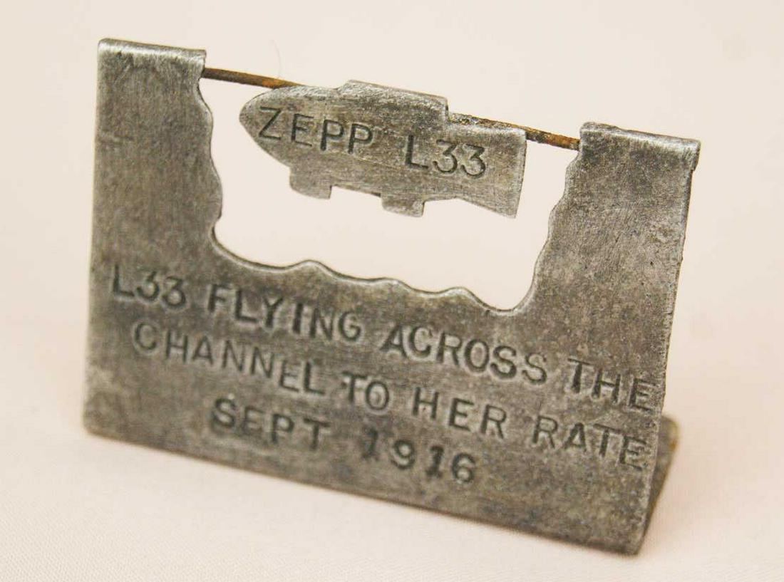UNUSUAL GERMAN WW1 ZEPPELIN L33 PLATE, TRENCH ART: UNUSUAL GERMAN WW1 ZEPPELIN L33 PLATE Trench art. Very collectible item. Were purchased in UK, nice trench art of World War I memorabilia. A badge made in aluminum from the crashed Zeppelin L33. Pleas