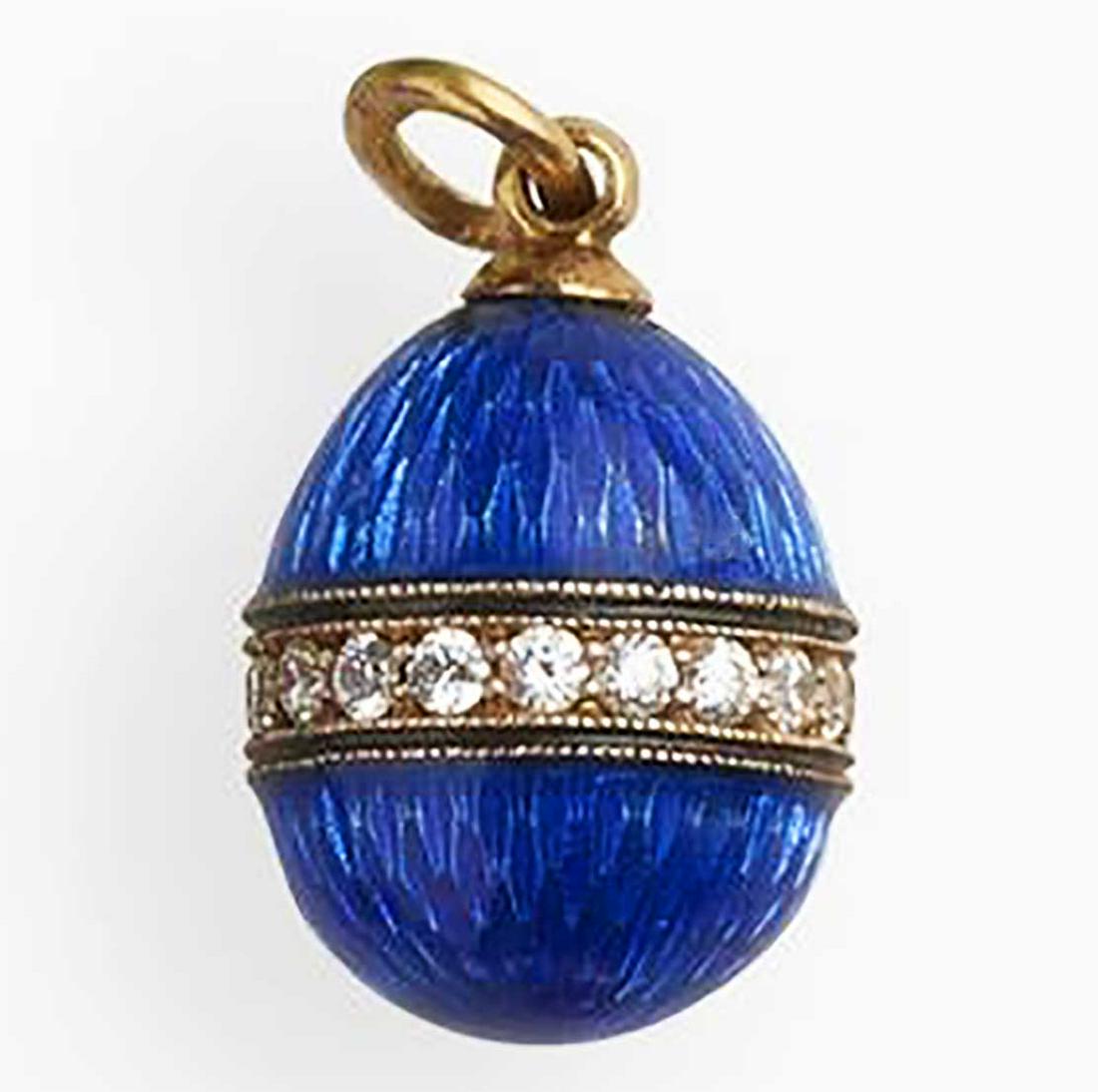 RUSSIAN IMPERIAL GUILLOCHE ENAMEL EGG PENDANT: RUSSIAN IMPERIAL GUILLOCHE ENAMEL EGG PENDANT In the manner of Faberge, Russian SILVER GILT or GOLD (?) and ENAMELED egg pendant. The egg is made with gilt washed finish. Also it has a Russian Imperia