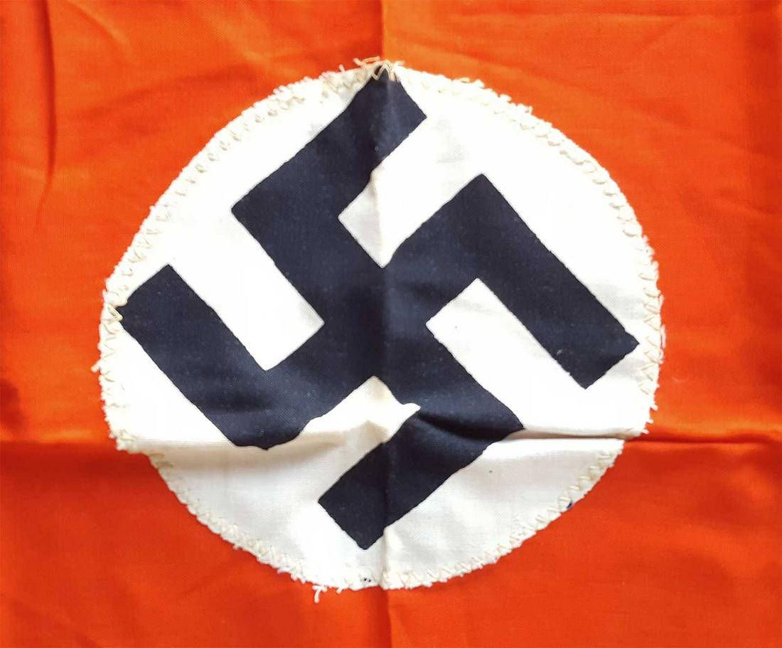 GERMAN WW2 NAZI NSDAP FLAG w. SWASTIKA: GERMAN WW2 NAZI NSDAP FLAG with SWASTIKA Red field with applied white disks printed with a mobile swastika. The hoist edge has been folded over and sewn, allowing the flag to be flown. Please note: la
