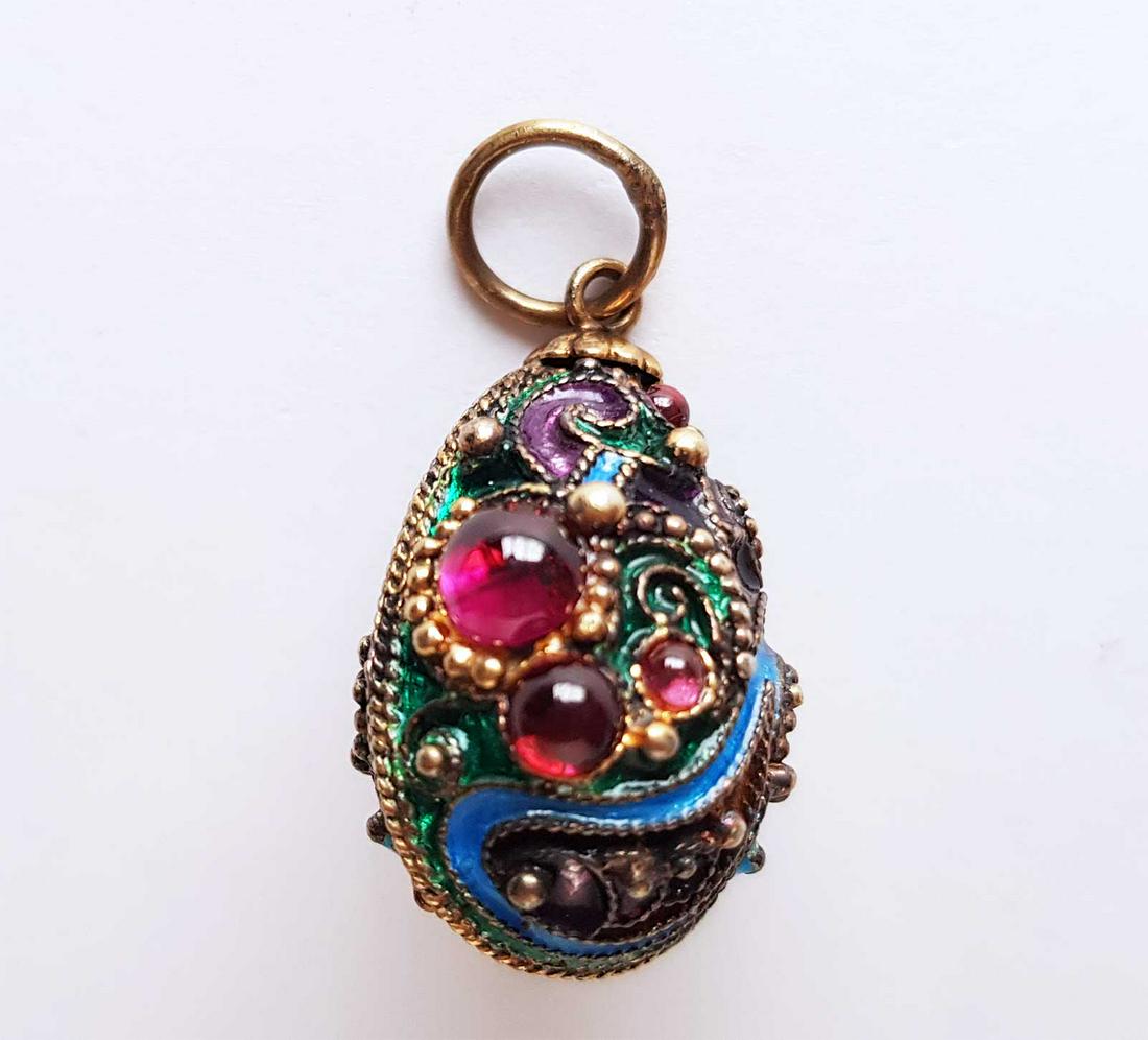 RUSSIAN SILVER PENDANT: RUSSIAN SILVER PENDANT COATED WITH ENAMEL AND GOLD. Gilt Silver, Enamel and Rhinestone Egg Form Pendant. The egg has a decorative pattern, covered with different color enamel and adorned with gilded