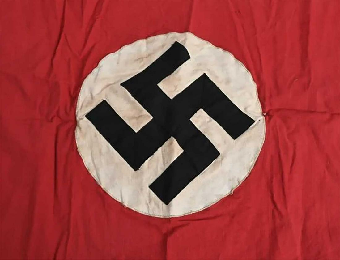 RARE GERMAN WWII NAZI NSDAP BANNER w. SWASTIKA: GERMAN WW2 NAZI NSDAP BANNER with SWASTIKA Multi-piece cotton construction banner. To both its red fields are sewn white disks, with a multi piece mobile swastikas in black. CONDITION: Shows the expec