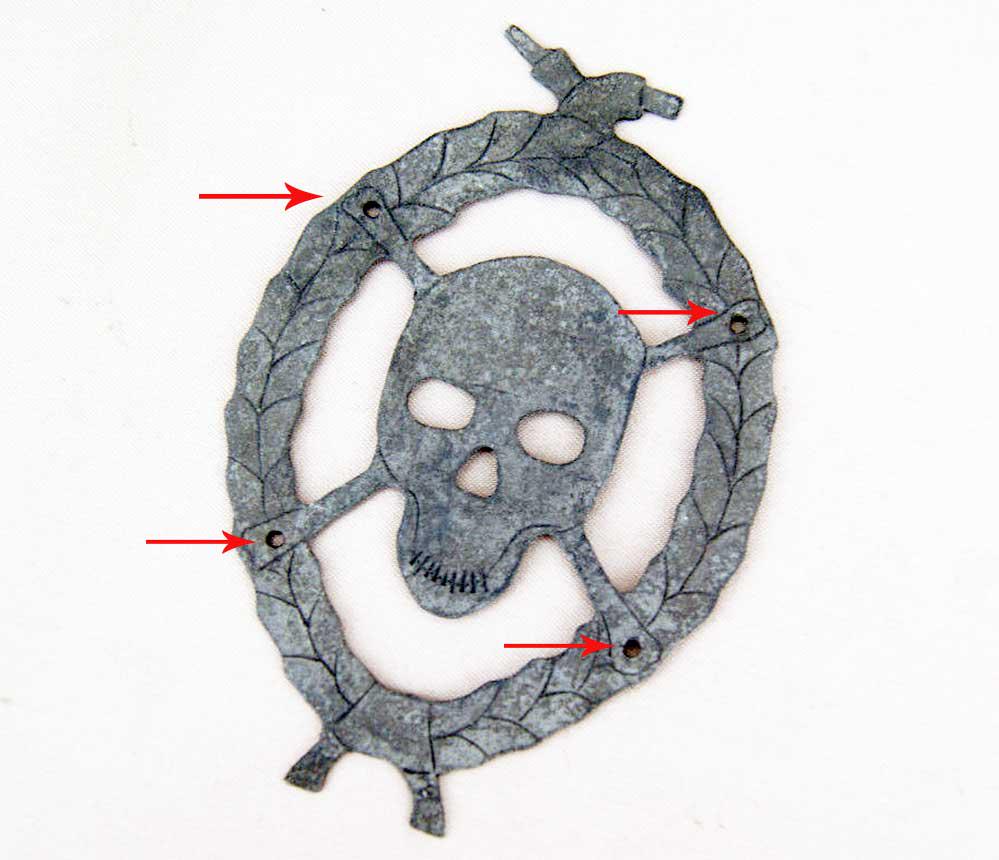 RARE GERMAN WW2 COCKARDE w. SKULL & BONES: RARE GERMAN WW2 COCKARDE with SKULL and BONES for HELMET Trench art, 1941-1945. Aluminum. CONDITION: The item is described to the best of our knowledge. Please refer to pictures and email with any que
