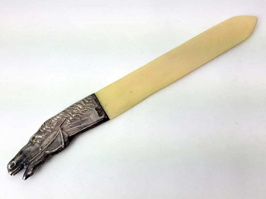 ANTIQUE RUSSIAN IMPERIAL SILVER LETTER OPENER: ANTIQUE RUSSIAN IMPERIAL SILVER LETTER OPENER The silver handle in horse head shape. Very interesting design. Hallmarked at the edge: 84 silver standard and AC in Cirylic for workmaster Aleksandr Vlad