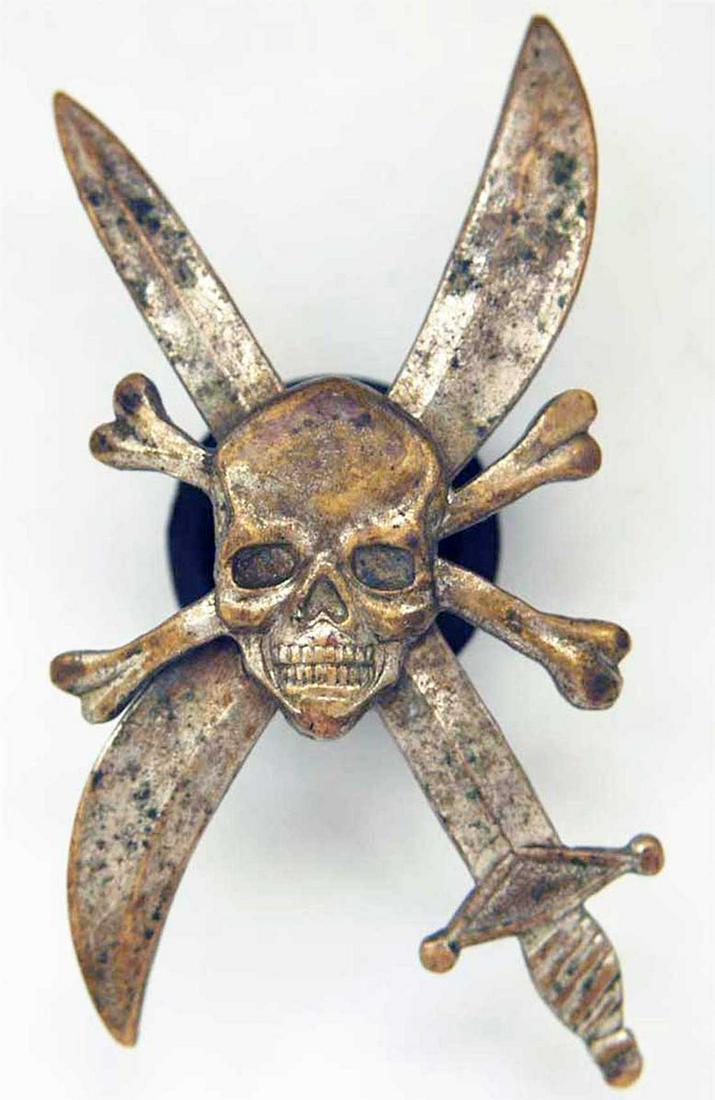 RUSSIAN WHITE GUARDS BADGE 31st CORPS AIR, 1917: VERY RARE RUSSIAN WHITE GUARDS BADGE 31st CORPS AIR, 1917 Silver human skull and BONES laid on a crossed sword and propeller. On the reverse of the badge is engraved the Inscription - 31 A. 0. Russian