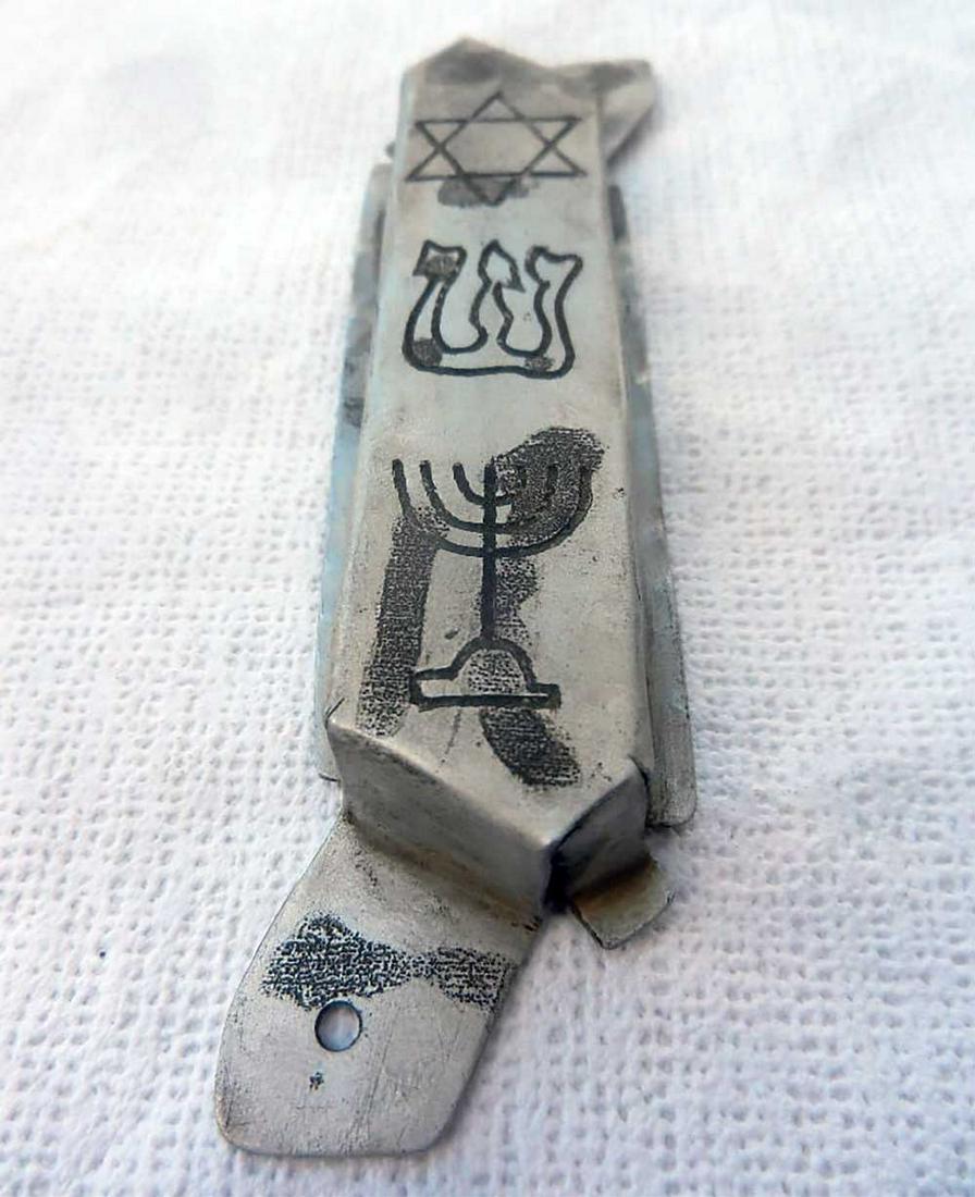JEWISH WW2 MEZUZAH CASE w. STAR of DAVID & MENORAH: JEWISH WW2 MEZUZAH CASE with STAR of DAVID and MENORAH from LITZMANNSTADT in POLAND Hand made, unusual design very nice job. Aluminum. CONDITION: The item is described to the best of our knowledge. Pl