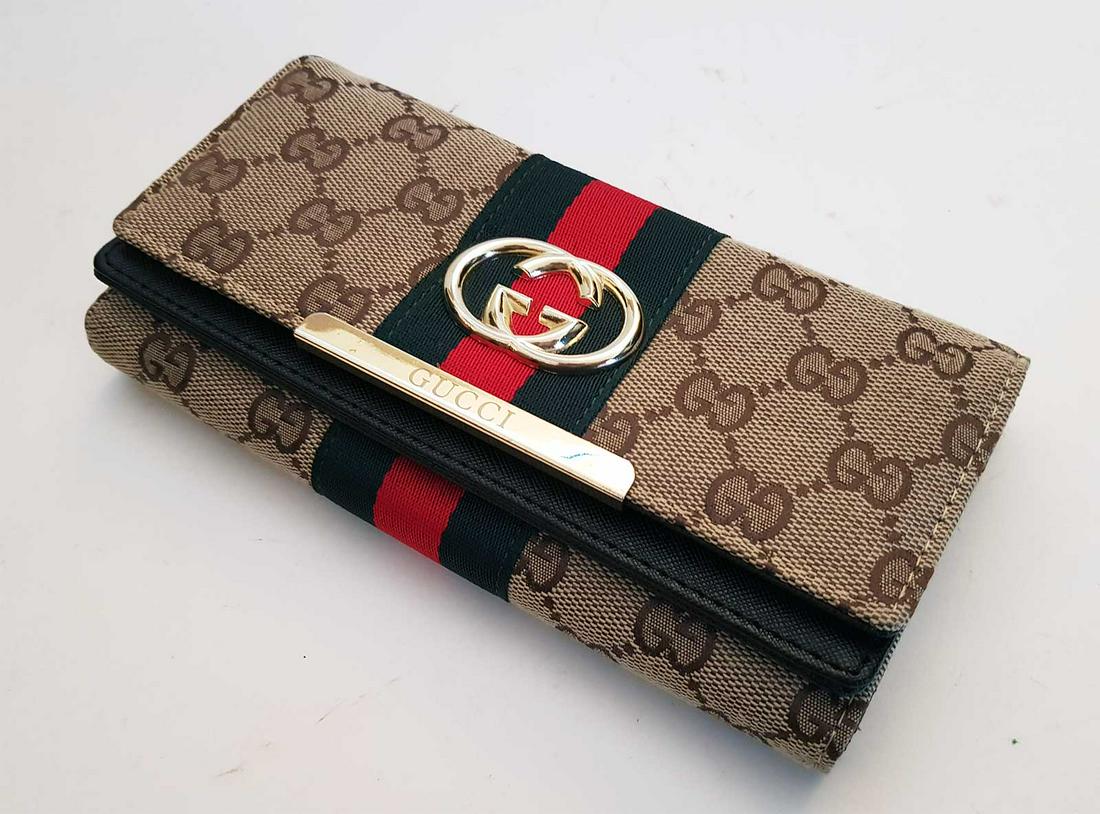 GUCCI WOMENS WALLET: WOMEN'S OPHIDIA GG CONTINENTAL WALLET Beige/Ebony GG Supreme canvas with brown leather trim. Green and red spider web. Gold-tone hardware. Double G. Twelve card slots and multiple bill slots. Button