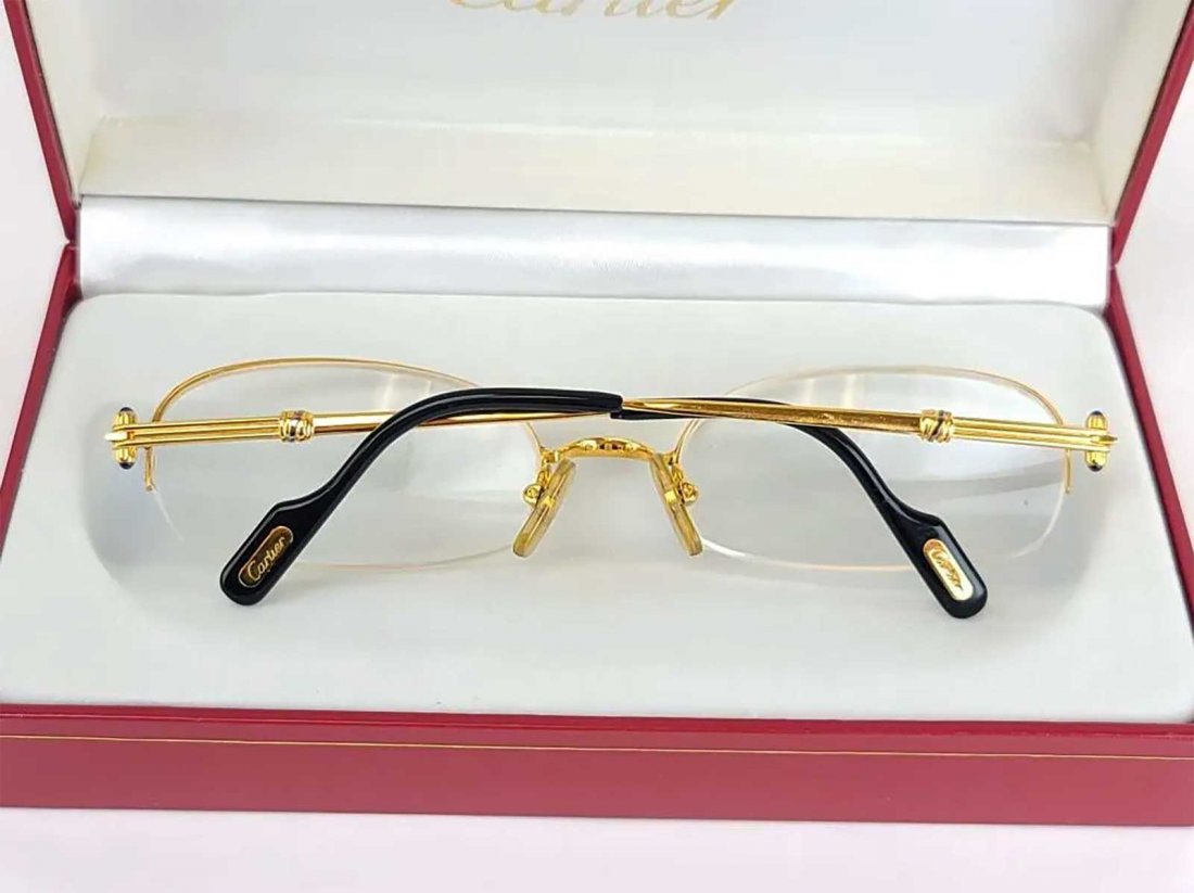 AUTHENTIC CARTIER EYE GLASSES w. BOX & PAPERS: AUTHENTIC CARTIER EYE GLASSES with BOX & PAPERS Original Cartier gilded eye glasses with box, papers and leather case. Set with cabochon supphire stones on temples. CONDITION: Very good, few times use