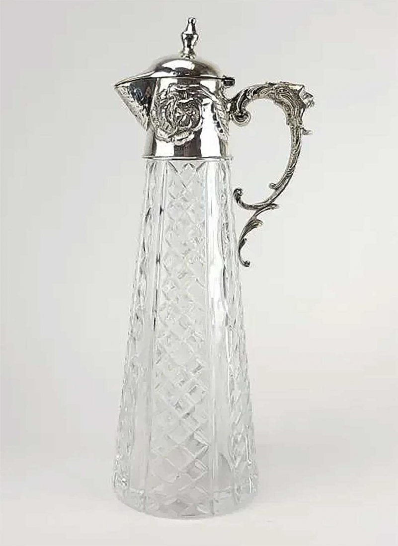 RUSSIAN SILVER MOUNTED CRYSTAL DECANTER: RARE ANTIQUE LARGE RUSSIAN SILVER MOUNTED CRYSTAL DECANTER Antique Russian cut crystal and silver mounts Decanter. Flower decor and mask style handle. Hallmarked on the rim and lid with Grachev Brothe