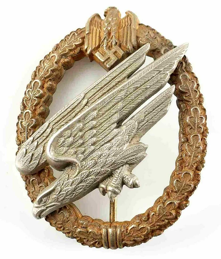 RARE GERMAN WW2 ARMY PARATROOPER BADGE: RARE GERMAN WW2 ARMY PARATROOPER BADGE, FALLSCHIRMJAGER A Third Reich Army paratrooper badge. War time zinc type. Reverse marked 'C.E. Junker Berlin'. CONDITION: Very good condition. The item is descr