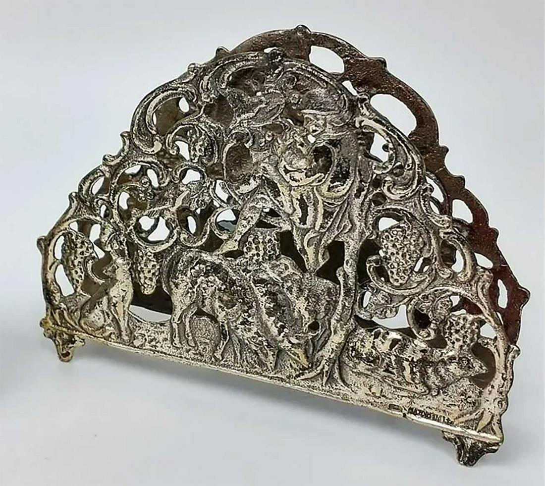 JEWISH STERLING SILVER NAPKIN HOLDER, LITZMANNSTADT: JEWISH STERLING SILVER NAPKIN HOLDER from LITZMANNSTADT in POLAND Very interesting design. CONDITION: The item is described to the best of our knowledge. Please refer to pictures and email with any qu