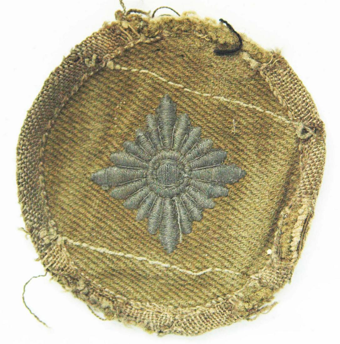 NAZI WW2 GERMAN AFRIKA KORPS RANK PIP, 1943: NAZI WW2 GERMAN AFRIKA KORPS RANK PIP, 1943 For Tropical Uniform. Olive cotton twill. It looks to be removed from uniforms. These came from a vet who brought back a lot of different patches. The patch