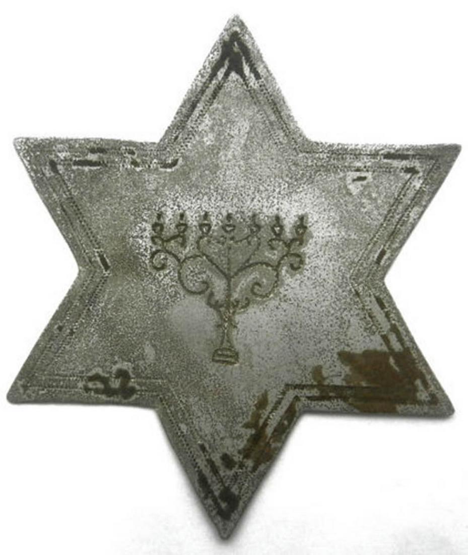 JEWISH WW2 STAR of DAVID w. MENORAH, 1941: RARE JEWISH WW2 STAR of DAVID with MENORAH from LEMBERG - LVIV (POLAND - Ukraine), 1941 The star is made from aluminum and engraved with Menorah. CONDITION: The item is described to the best of our kn
