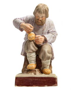 GARDNER - RUSSIAN PORCELAIN FIGURINE, 19th CENTURY: GARDNER - RARE RUSSIAN IMPERIAL PORCELAIN FIGURINE, 19th CENTURY A naturalistic porcelain figurine depicting a peasant making traditional shoes from a bark (bast shoes). The figurine is skilfully
