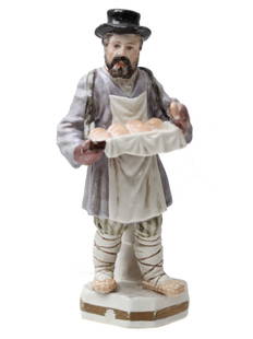 GARDNER - ANTIQUE RUSSIAN PORCELAIN FIGURINE, 19th C.: GARDNER - ANTIQUE RUSSIAN PORCELAIN FIGURINE, 19th CENTURY An antique Russian porcelain Gardner figurine on the base depicting a realistically modeled bulochnik (pastry-seller), shown with a tray of