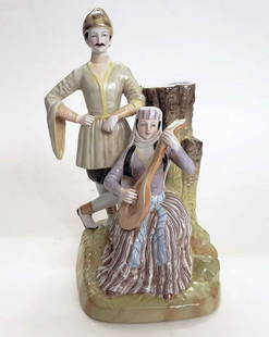 GARDNER - RUSSIAN PORCELAIN GEORGIAN GROUP: GARDNER - RUSSIAN PORCELAIN GEORGIAN GROUP A Russian porcelain spill vase with a georgian man and woman. From the 'People of Russia' series, Gardner porcelain factory, Moscow, 1880s-1890s Gardner