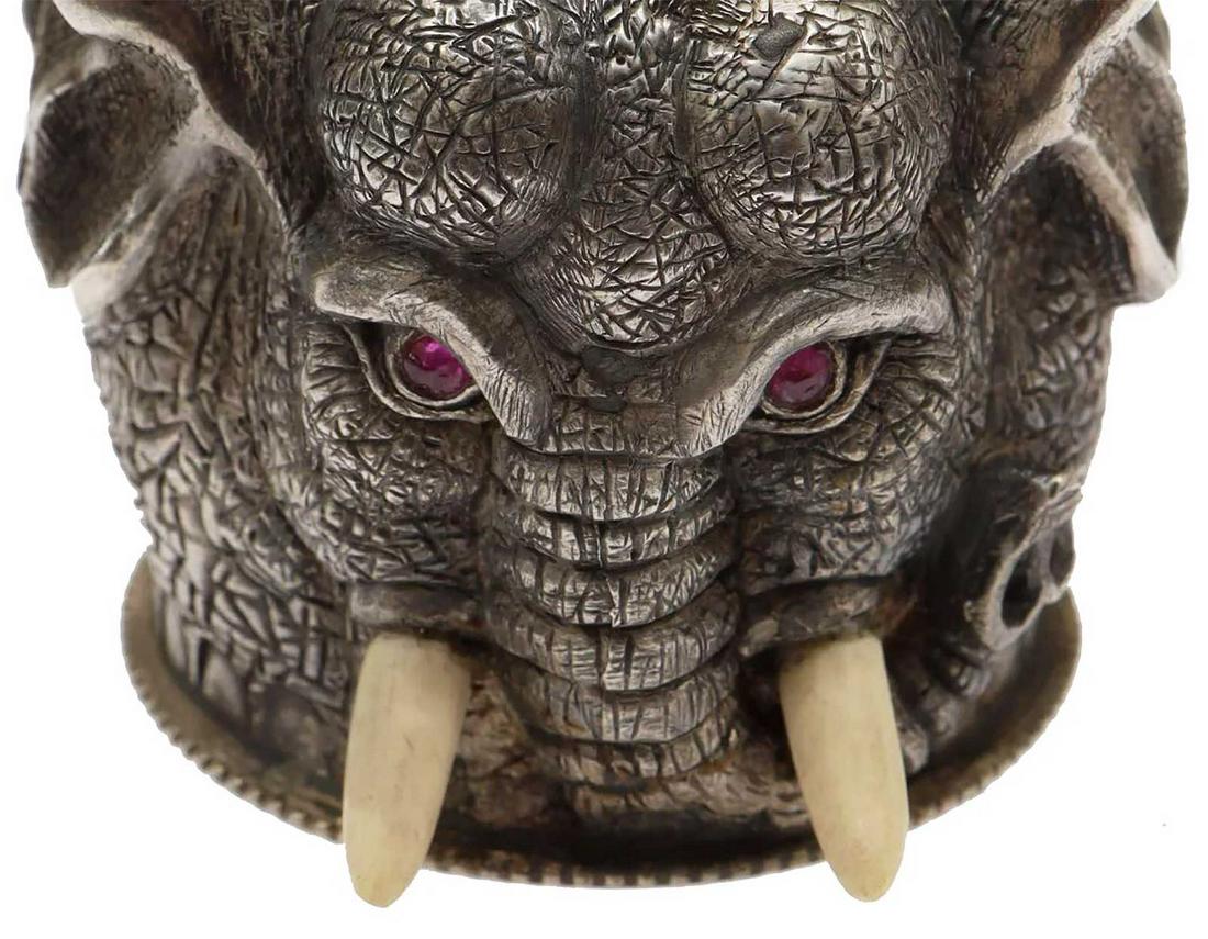 ANTIQUE RUSSIAN SILVER ELEPHANT HEAD STIRRUP CUP: ANTIQUE RUSSIAN GILT SILVER ELEPHANT HEAD STIRRUP CUP The elephant's tusks are naturalistically made of bone and eyes are decorated with crimson faceted stones. HALLMARKS: '88' silver standard next to