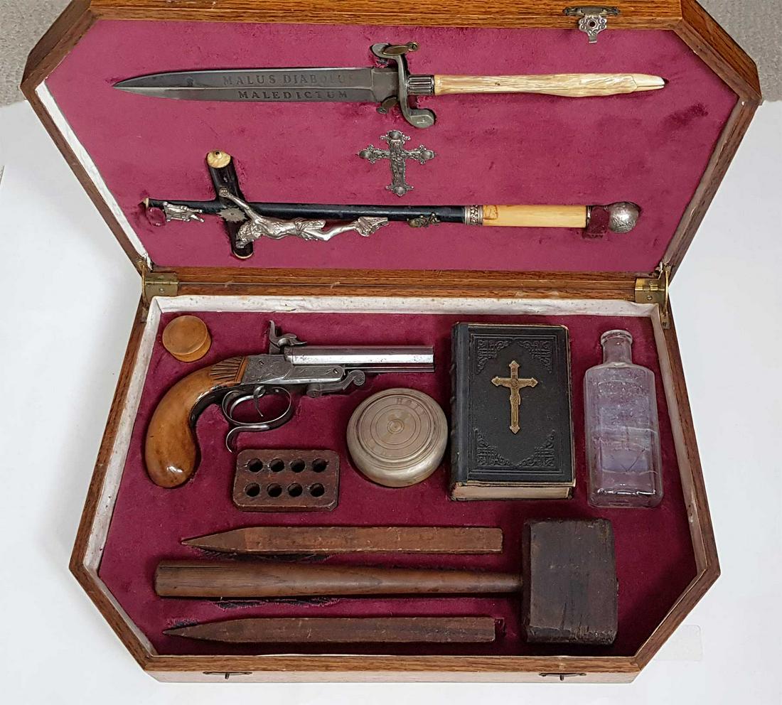 EXTREMELY RARE VAMPIRE HUNTER SLAYING KIT, NAMED, 1844: EXTREMELY RARE ANTIQUE VAMPIRE HUNTER SLAYING KIT, NAMED, 1844 Extremely rare 19th Century Vampire Killing Kit. Set includes pistol, cross, holy water bottle, German prayer book, a hammer with 2 stake