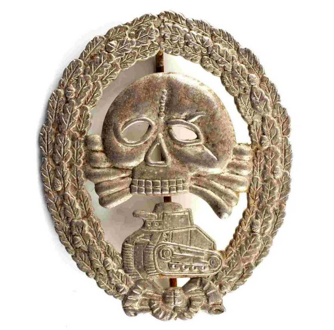 GERMAN WW2 LEGION CONDOR TANK BADGE, CASED: GERMAN WW2 THIRD REICH CONDOR LEGION TANK BADGE, CASED WWII German Condor Legion tank badge cased. Measures approximately 2 x 2.5 inches and features a 180 degree pin lie with a 'C' catch hook on th r