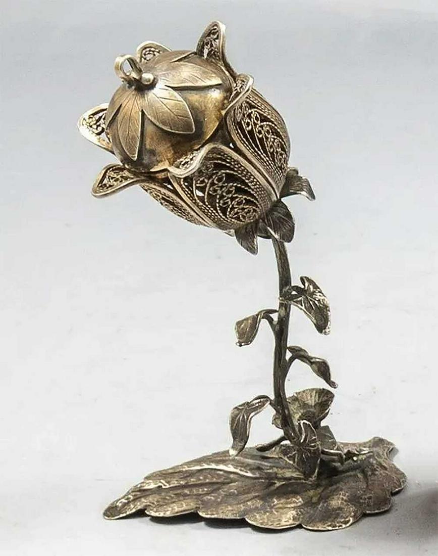JEWISH SILVER BESAMIM SPICE CONTAINER, 19c.: RARE JEWISH SILVER BESAMIM SPICE CONTAINER, 19th CENTURY Designed as a flower. Rare besamim spice container. DIMENSIONS: 4 7/8 x 3 1/2 inches (12.5 x 8.5 cm). Weight: 120 grams. CONDITION: Overall con