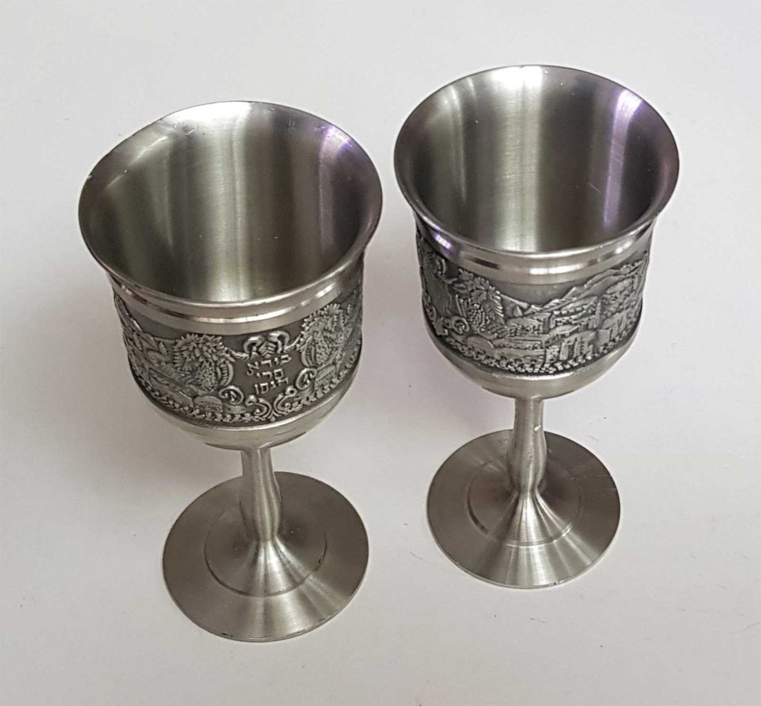 JEWISH TWO SILVER KIDDUSH GOBLETs: JEWISH TWO SILVER KIDDUSH GOBLETs Jewish kiddush cups. Hallmarked underside. DIMENSIONS: 5 3/4 x 2 3/4 inches (14.5 x 7 cm). Weight: 454 grams. ESTIMATE PRICE: $100 - $500. NO RESERVE: More than 90% o