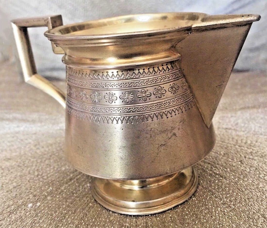 FABERGE - RUSSIAN SILVER CREAMER, 1897: FABERGE - RARE RUSSIAN IMPERIAL SILVER CREAMER, 1897 This is a nice item made by Johan Victor Aarne, a Faberge workmaster, in 1897. HALLMARKS: The cup has a few marks: '84' for silver, year '1897' and