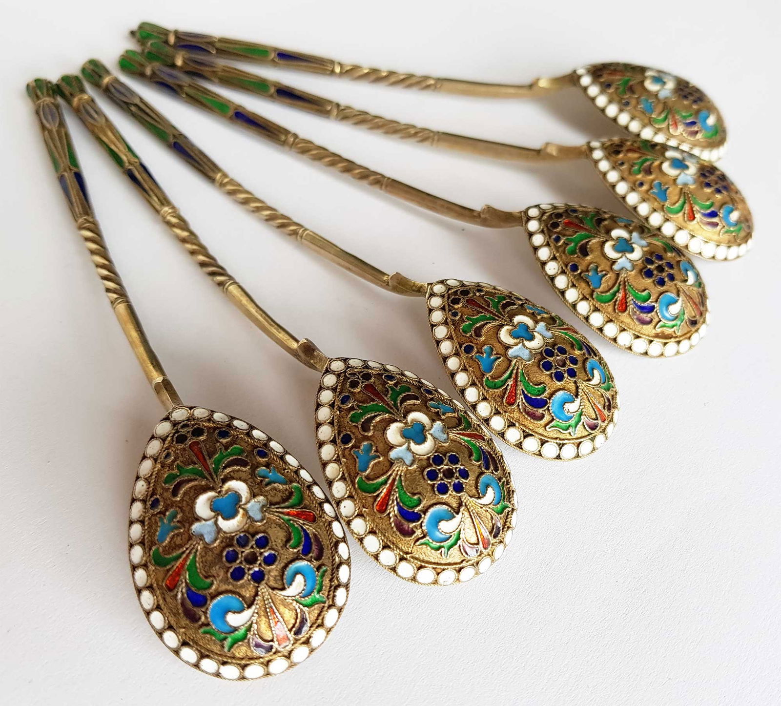 RUSSIAN ANTIQUE 6 SILVER & ENAMEL SPOONS, CASED: RUSSIAN ANTIQUE SIX SILVER and ENAMEL SPOONS, CASED, MARKED A set of six silver-gilt tea spoons, cased. DIMENSIONS: 6 inches (15.2 cm) - large size for tea spoon. ESTIMATE PRICE: $2,000 - $4,000. COND