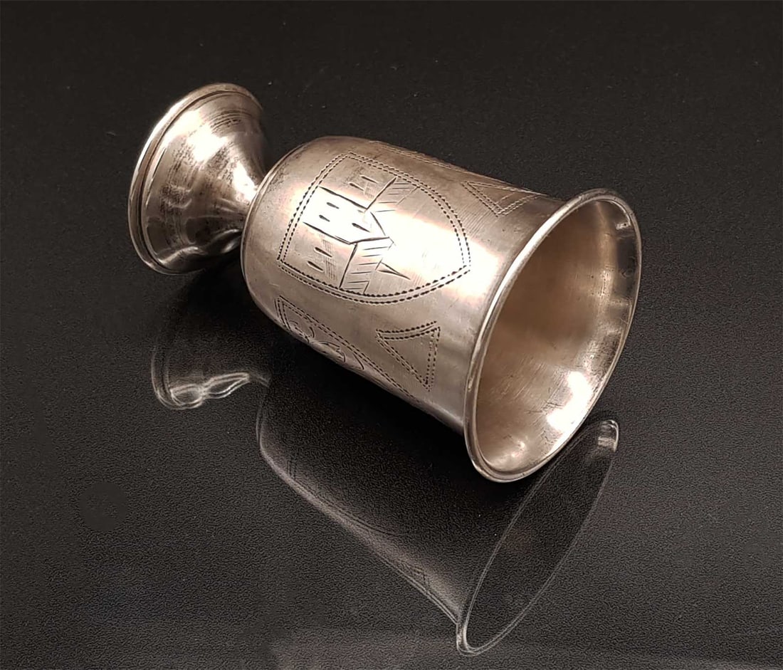JEWISH RUSSIAN SILVER KIDDUSH CUP: JEWISH RUSSIAN SILVER KIDDUSH CUP This silver Jewish Kiddush cup, crafted in Russia, features intricate engravings and dates back to the 19th century HALLMARKS: '84' for silver standard, 'GR" in Cyril