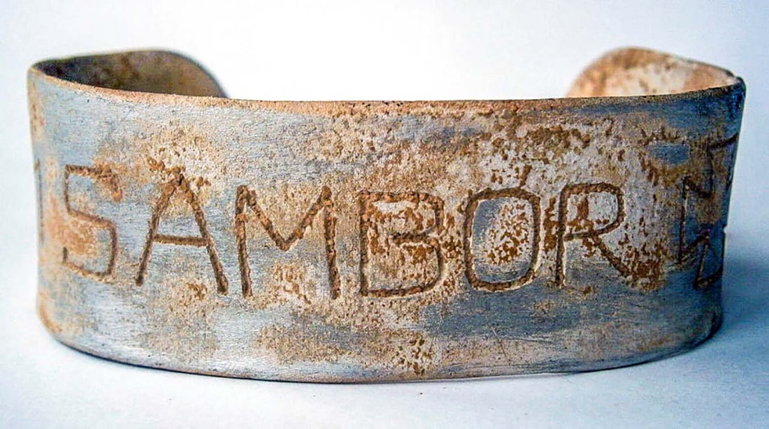 GERMAN WWII BRACELET w. IRON CROSS, SAMBOR: GERMAN WWII BRACELET with IRON CROSS, SAMBOR German WWII bracelet with an Iron Cross and the word 'Sambor' engraved on it. Sambor (Sambir) is a city in Ukraine that had a Jewish ghetto during WW2. Thi