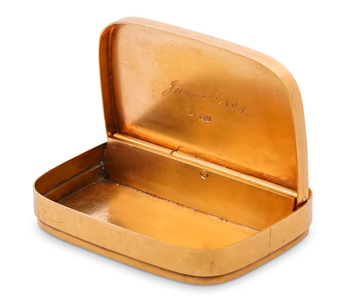 GOLD ANTIQUE RUSSIAN PILLS BOX, 1894: ANTIQUE RUSSIAN GOLD PILLS BOX, 1894 For your viewing, the yellow gold box is decorated along the top with ornate enveloping vine motifs. The hinged lid opens, revealing an engraved date: 'June 9th, 1