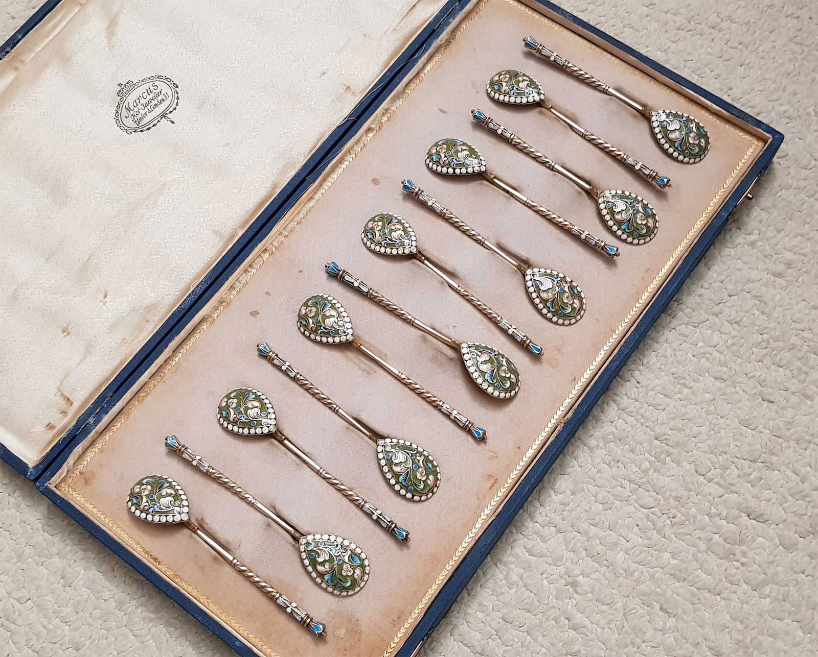 RUSSIAN SILVER GILT & ENAMEL 12 SPOONS, BOXED: ANTIQUE RUSSIAN SILVER GILT and ENAMEL 12 COFFEE SPOONS, BOXED A set of twelve Russian enameled silver coffee spoons, presented in a fitted case. HALLMARKS: '84' for silver content and 'DN' in Cyrilli