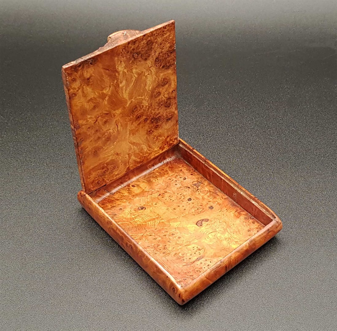 ANTIQUE RUSSIAN KARELIAN BIRCH CIGARETTE CASE: ANTIQUE RUSSIAN KARELIAN BIRCH CIGARETTE CASE Antique Russian Karelian birch wood presentation cigarette case with a seamless hidden hinge, circa the late 19th century. PROVENANCE: 1. From an old repu