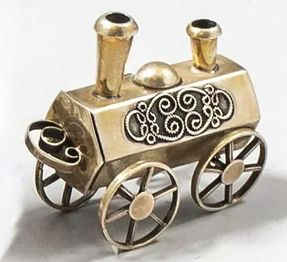 JEWISH SILVER BESAMIM SPICE CONTAINER: RARE ANTIQUE JEWISH SILVER BESAMIM SPICE CONTAINER This rare Besamim spice container is shaped like a locomotive, featuring a unique and rare design. The Besamim spice box is traditionally used during